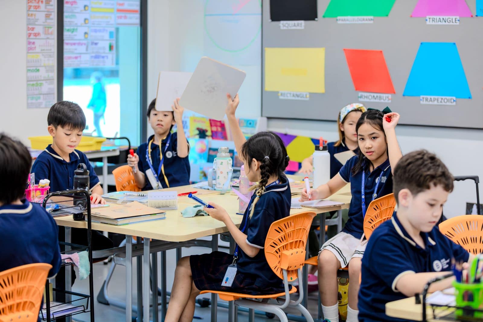 Primary school-age children being taught in school.