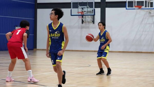 BASIS TUSKERS basketball players during an indoor game