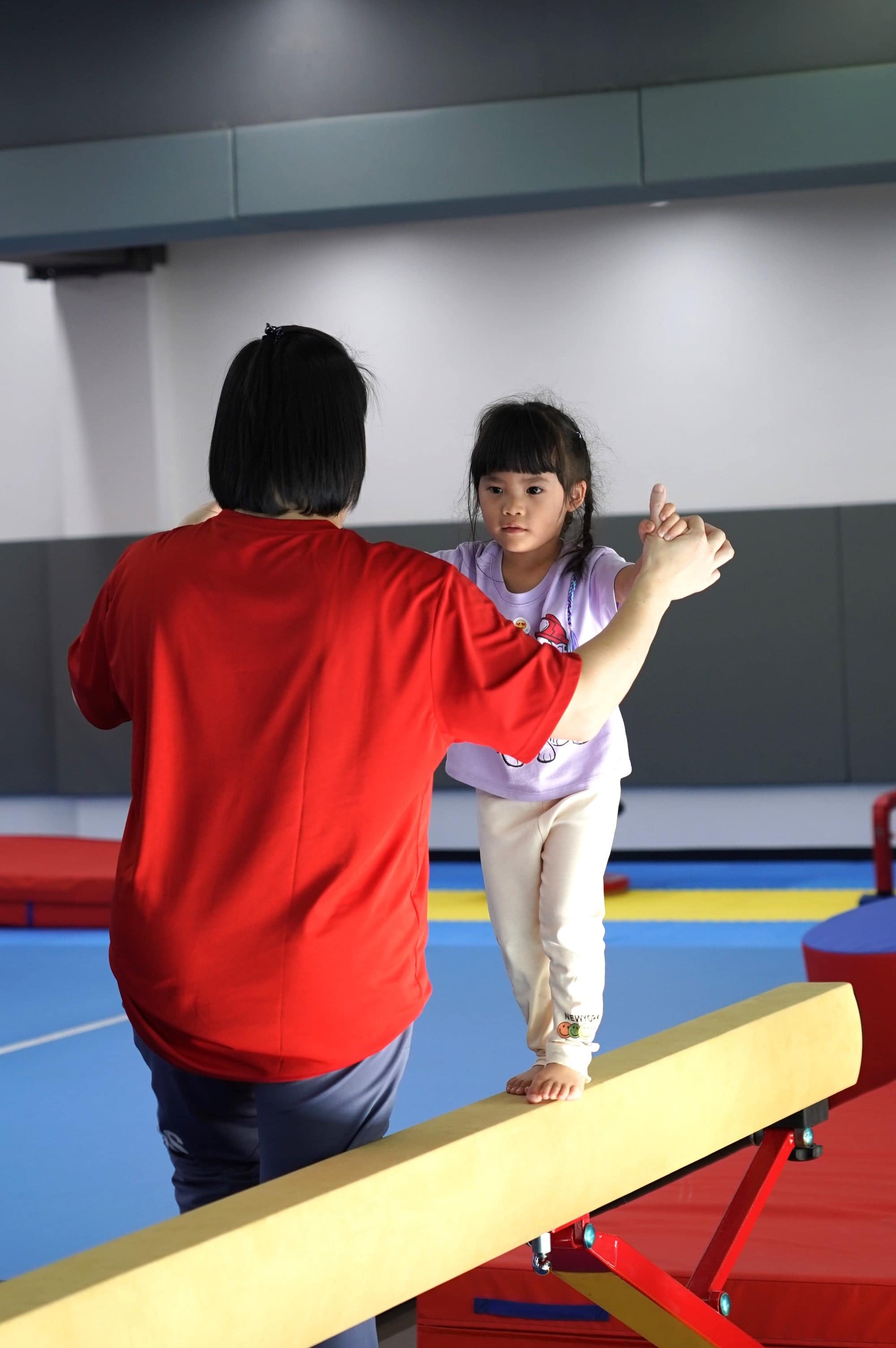 A coach working one to one with a BASIS International School Bangkok student