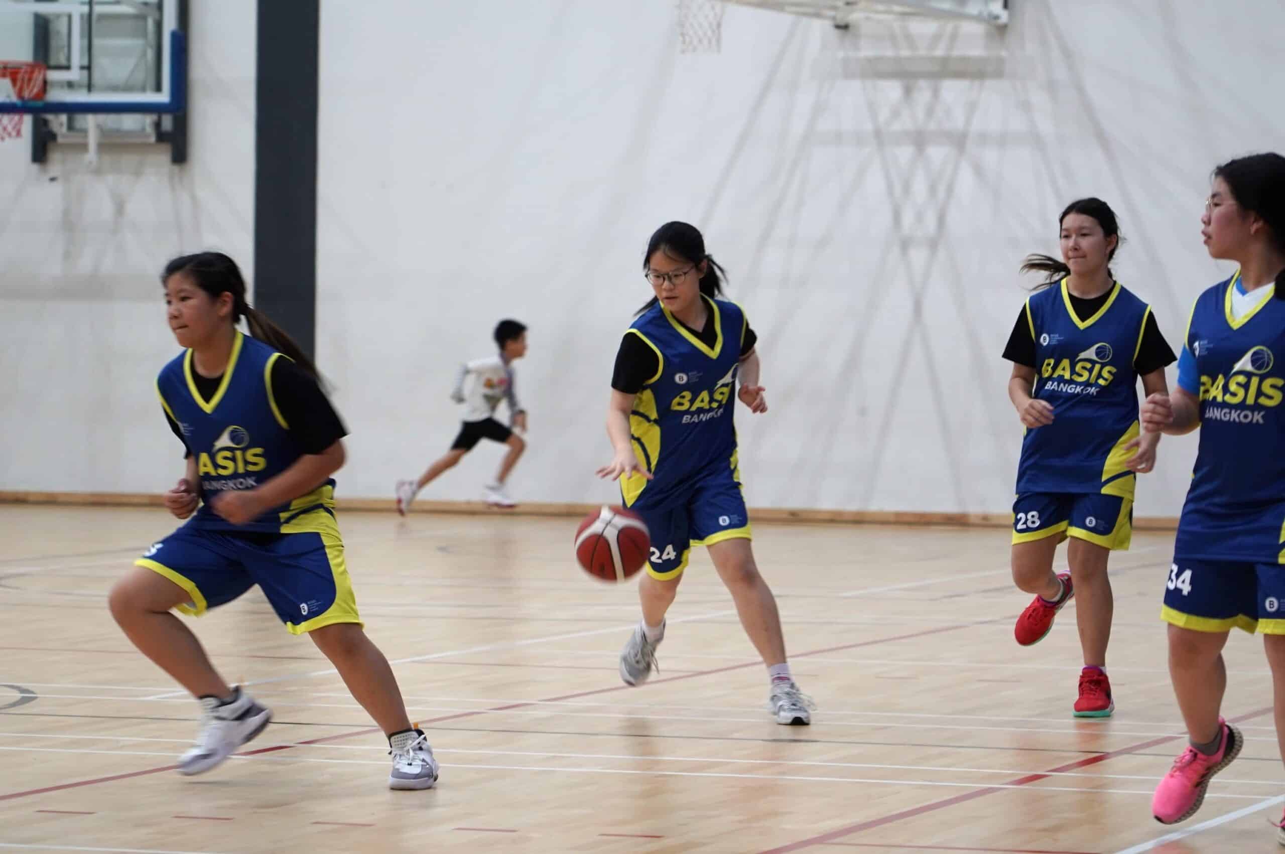 BASIS TUSKERS basketball players during an indoor game