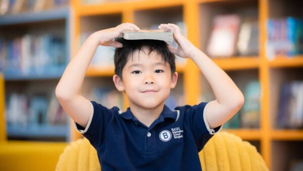 A young BASIS International School Bangkok student in the school library