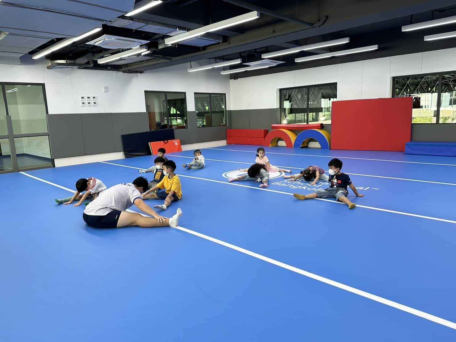 BASIS International School Bangkok students warming up in the sports complex