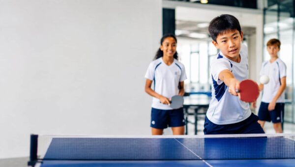 BASIS International School Bangkok students playing table tennis indoors
