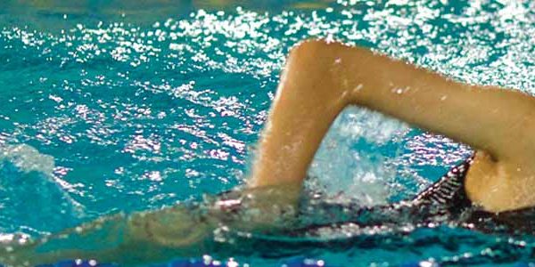 A BASIS International School Bangkok student swimming front crawl in the 25 meter competition pool