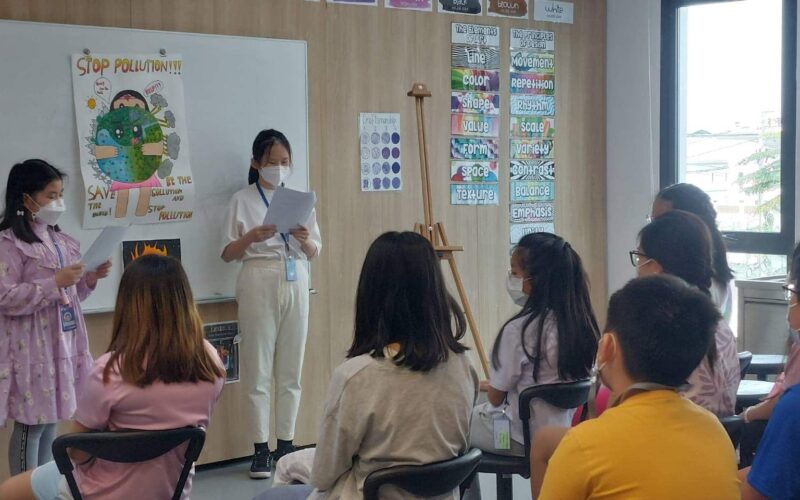 BASIS International School Bangkok students presenting artwork on display in class