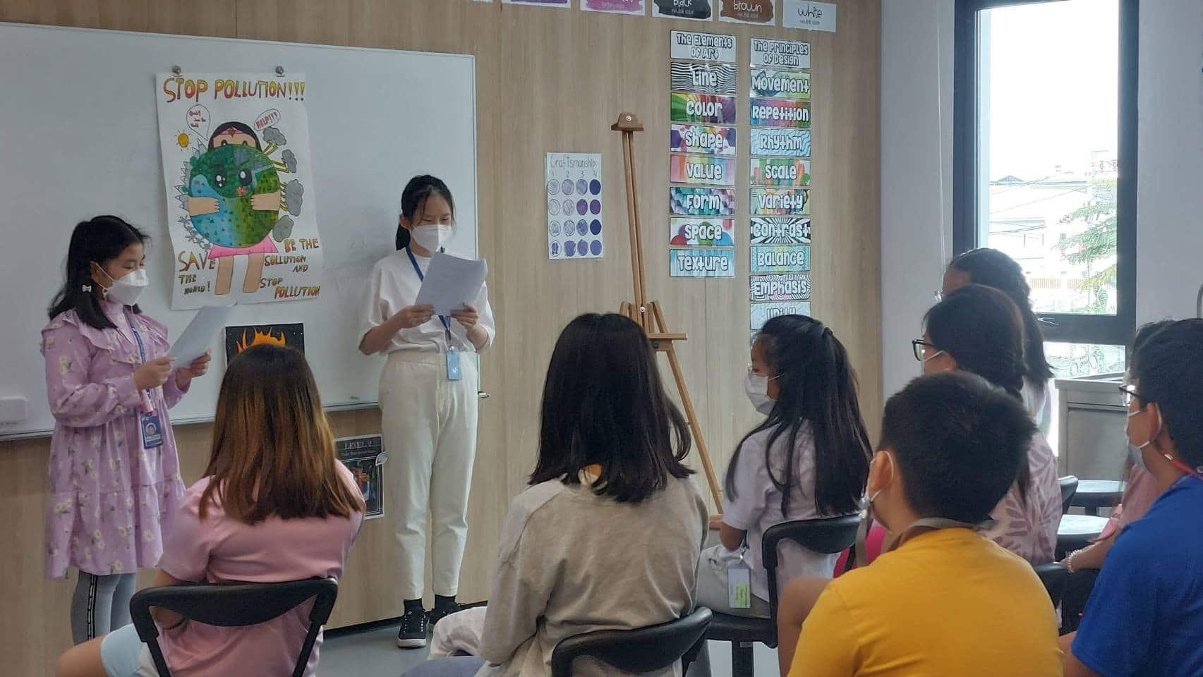 BASIS International School Bangkok students presenting artwork on display in class